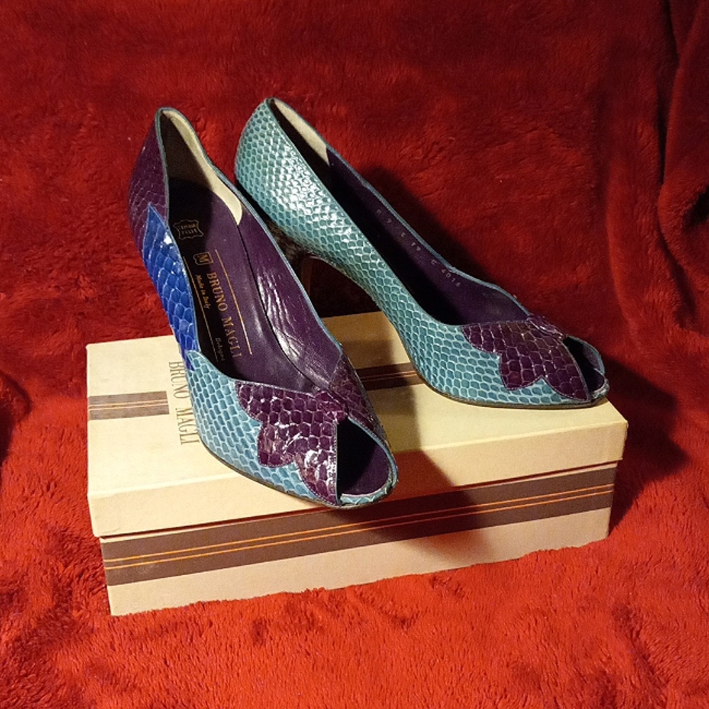 Bruno Magli multi colored snakeskin, opened toed pump with a flower on the toe.